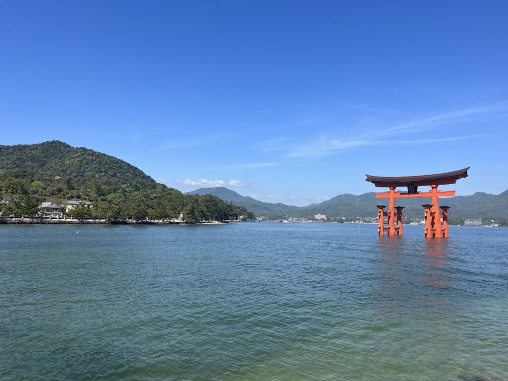 A Torii gate and mountain in Miyajima Island, Japan