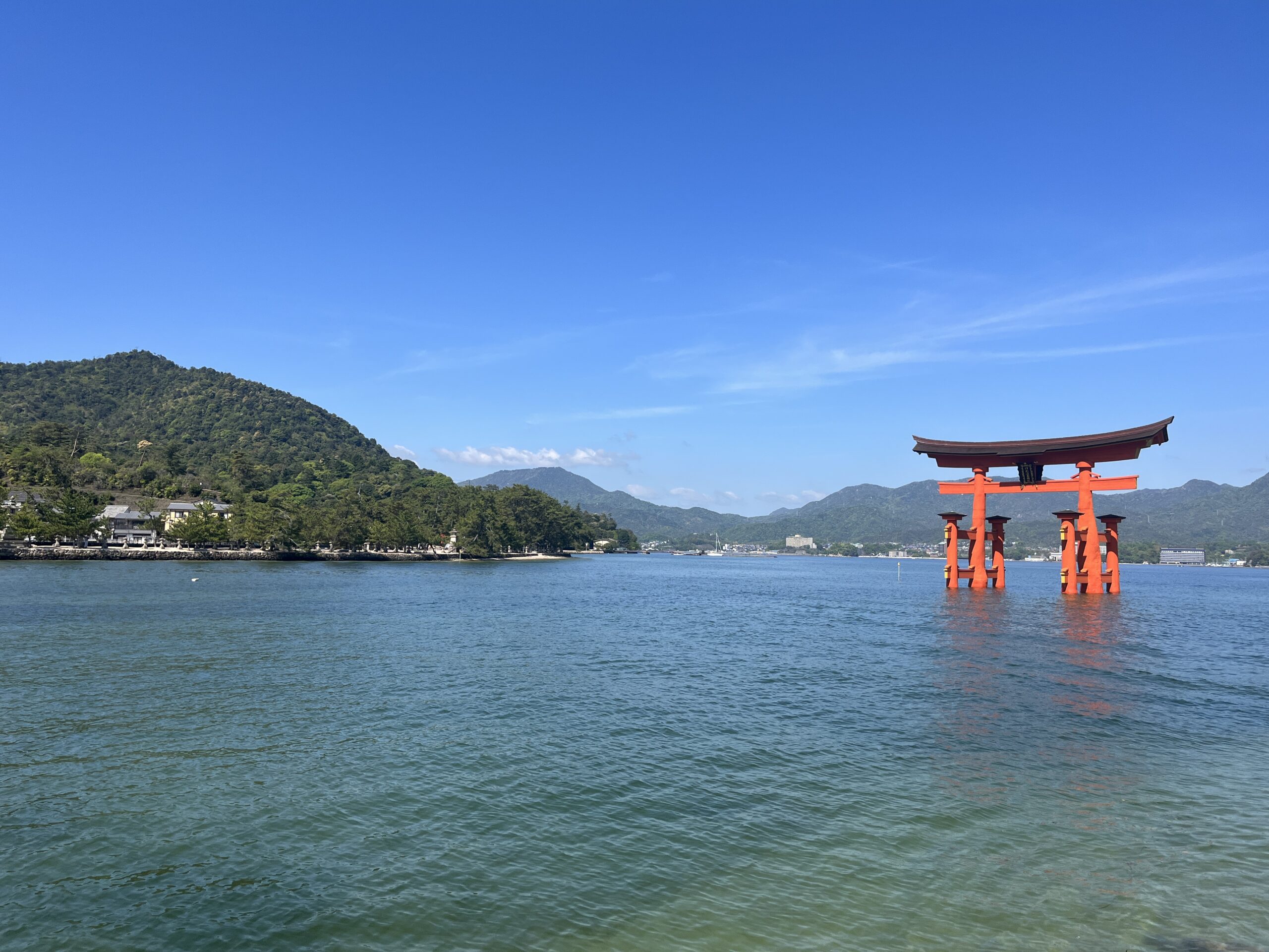 A Torii gate and mountain in Miyajima Island, Japan